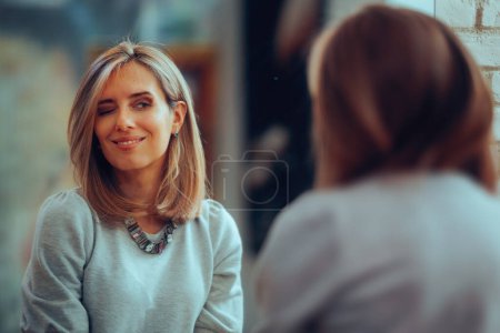 Woman Looking in the Mirror Admiring her New Hairstyle  