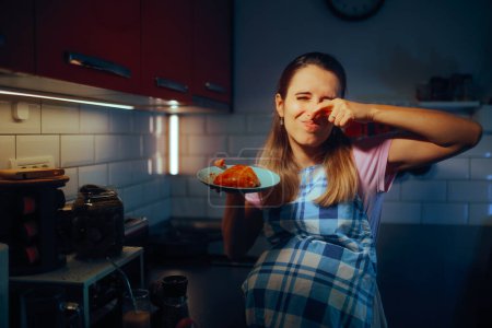Pregnant Woman Disliking the Smell of Meat Cooking it 