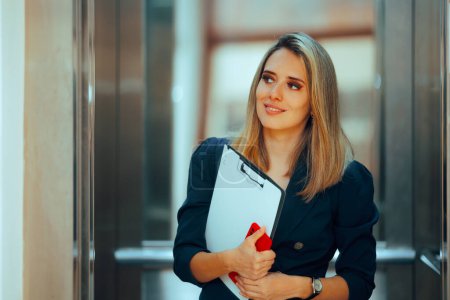 Businesswoman with a Clipboard Riding an Elevator at Work 