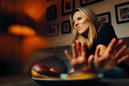 Woman Refusing to Eat Unhealthy Donuts 