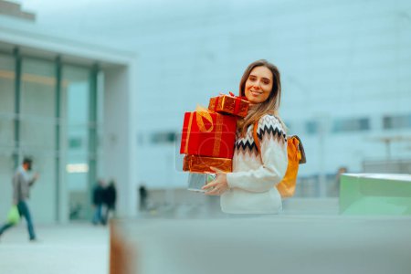 Woman Holding many Gift Boxes Shopping for Christmas 