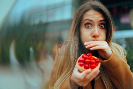Woman feeling Sick from Eating a Fruit Tart 