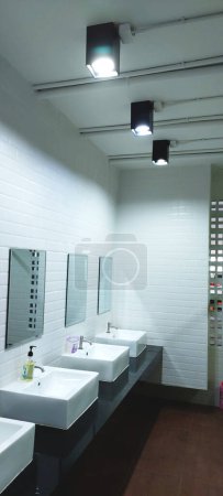 toilet design use white  against black with over lantern