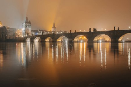 Photo for Charles bridge at foggy autumn night, Prague, Czech Republic - Royalty Free Image