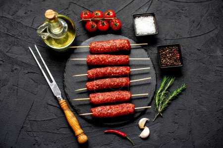 Photo for Raw sausages with spices and herbs, food concept - Royalty Free Image