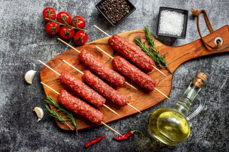 Photo for Raw sausages with spices and herbs, food concept - Royalty Free Image