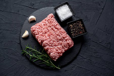 Photo for Raw minced meat with spices and herbs, close up view - Royalty Free Image