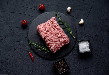 Photo for Raw minced meat with spices and herbs, close up view - Royalty Free Image