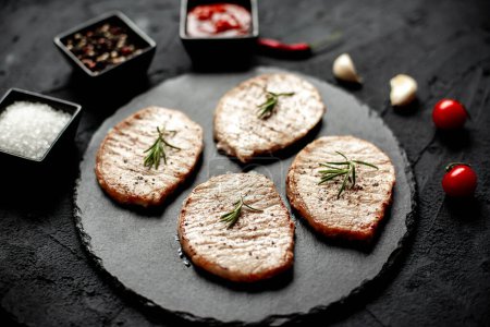 Photo for Grilled beef steak with rosemary and herbs, close up view - Royalty Free Image