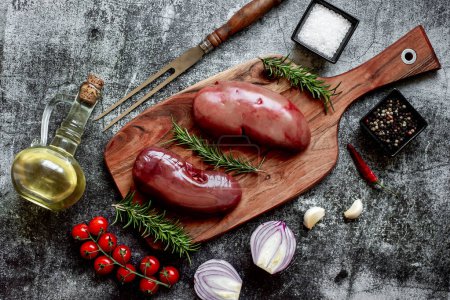 Photo for Raw pork kidneys with spices, close up view - Royalty Free Image