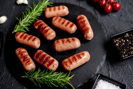 Photo for Grilled sausages with spices and herbs - Royalty Free Image
