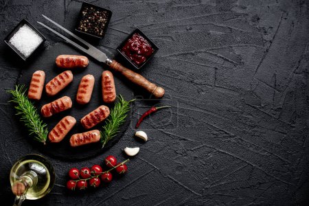 Photo for Grilled sausages with spices and herbs - Royalty Free Image