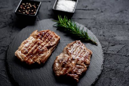 Photo for Grilled meat steak with spices and herbs, food concept - Royalty Free Image