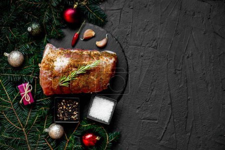 Photo for Christmas food concept. Raw meat with spices and Christmas decorations on rustic background - Royalty Free Image