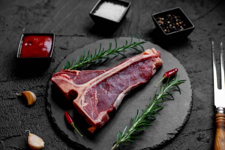 Photo for Raw meat with spices and rosemary. cooking background - Royalty Free Image