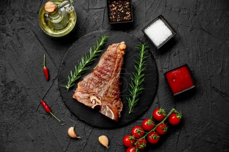 Photo for Delicious grilled meat with spices and rosemary - Royalty Free Image