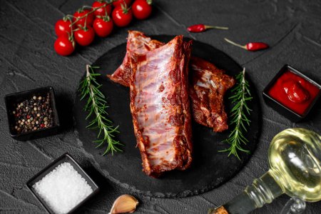 Photo for Raw marinated pork ribs with spices on stone background - Royalty Free Image