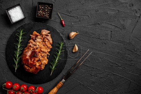 Photo for Pork cooked in the oven on a stone background - Royalty Free Image