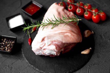 Photo for Raw pork meat on stone background with spices, herbs - Royalty Free Image