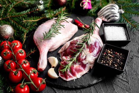 Photo for Raw duck legs with spices and Christmas decorations on stone background - Royalty Free Image