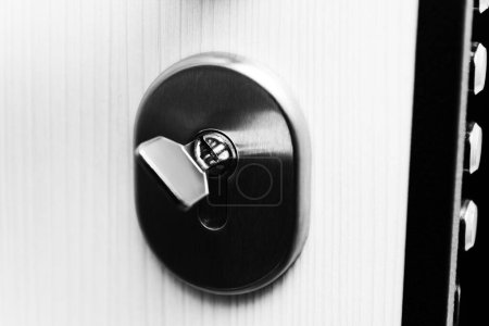 Photo for Modern Metal Key and Key Hole and Door - Very Sturdy Steel Door - Royalty Free Image
