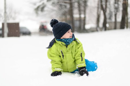 Photo for Boy Playing in Snow in the Woods While on Vacation - Royalty Free Image