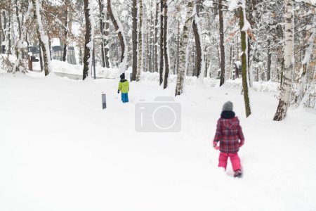 Photo for Two Adorable Young Siblings Having Fun Together in Beautiful Winter Park - Royalty Free Image