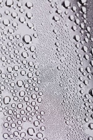 Photo for Drops and trickles of water on the glass. It occupies the entire surface of the image. Close-up. - Royalty Free Image