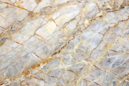 Texture de marbre blanc avec des veines dorées