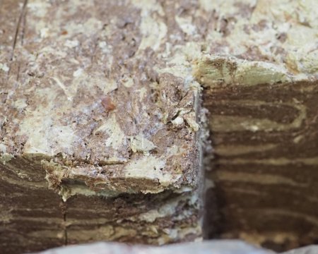 Luxurious Slice of Halva on Dark Counter: Detailed Capture of an Eastern Delicacy