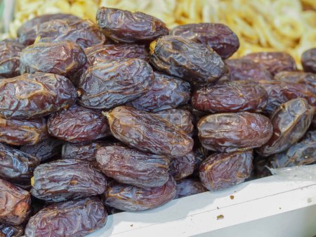 Close-Up of Bright and Appetizing Dried Dates on a Store Counter