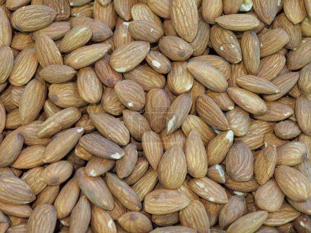 A Large Pile of Almonds on a Store Counter Fresh and Aromatic Nut for Healthy Eating