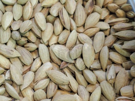 Unshelled Pistachios on a Store Counter: Eastern Delicacies, Richness of Flavor and Nature