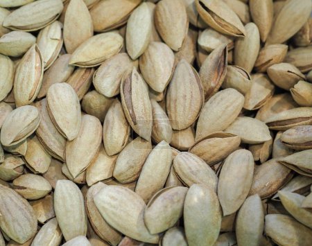 Unshelled Pistachios on a Store Counter: Eastern Delicacies, Richness of Flavor and Nature