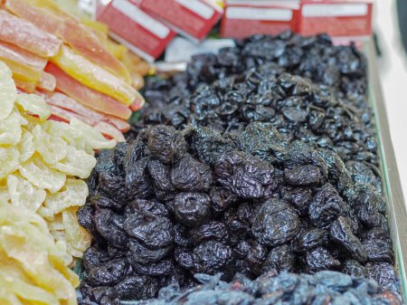 Photo for Taste of Eastern Traditions: An Assortment of Dried Fruits at a Market Stall - Royalty Free Image
