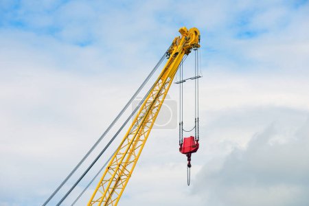 crane boom against the blue sky