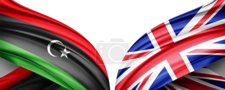 Foto de Bandera de Libia y bandera del Reino Unido de seda y fondo blanco-3D ilustración. - Imagen libre de derechos
