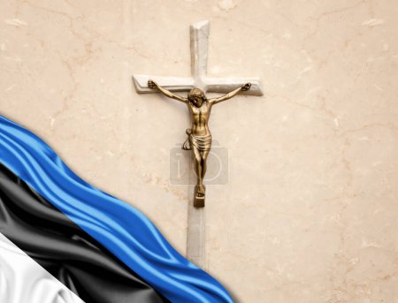 Foto de Bandera de Estonia de seda con Jesucristo, estatua, cruz, apoyada sobre fondo de mármol - Imagen libre de derechos