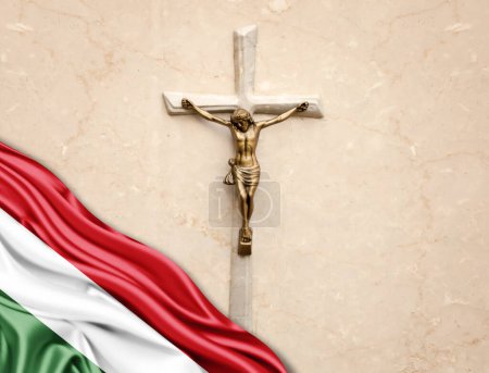 Foto de Bandera de Hungría de seda con Jesucristo, estatua, cruz, apoyada sobre fondo de mármol - Imagen libre de derechos