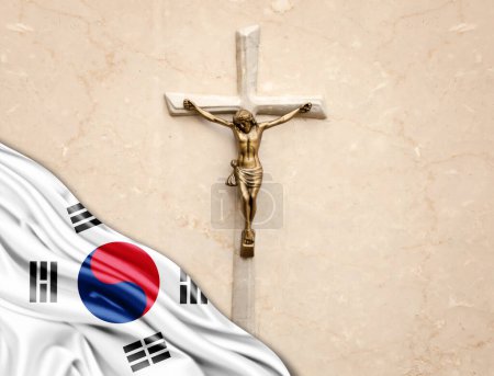 Foto de Bandera de Corea del Sur de seda con Jesucristo, estatua, cruz, apoyada sobre fondo de mármol - Imagen libre de derechos