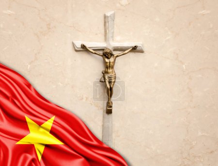 Foto de Bandera de Vietnam de seda con Jesucristo, estatua, cruz, apoyada sobre fondo de mármol - Imagen libre de derechos