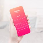 Woman holding mobile phone with menstrual cycle calendar app on white room background. pink app design