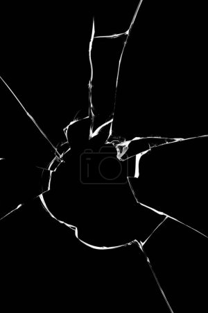 Cracks of broken glass, texture isolated on black background. Broken window concept for design.