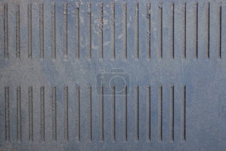 Photo for Black gray metal texture from an old dirty iron cover with a grate for ventilation - Royalty Free Image