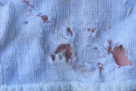 Photo for White fabric texture on torn cloth with holes on old clothes - Royalty Free Image