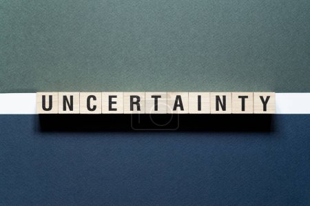 Photo for Uncertainty - word concept on cubes, text, letters - Royalty Free Image