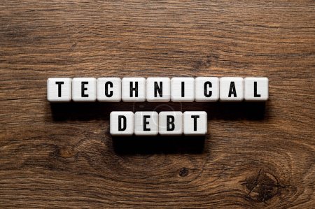 Technical debt - word concept on building blocks, text, letters