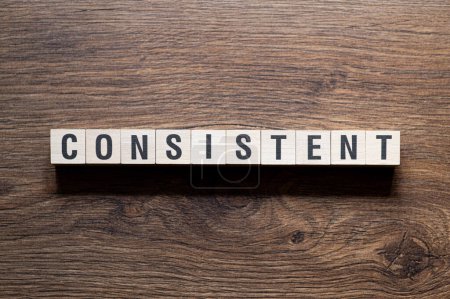 Photo for Consistent - word concept on building blocks, text, letters - Royalty Free Image