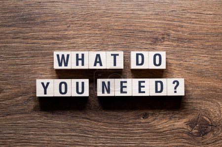 What do you need - word concept on building blocks, text, letters