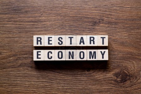 Restart economy - word concept on building blocks, text, letters